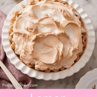 Pinterest graphic of a whole lemon meringue pie in a white baking dish with some lemons and lavender to the side.