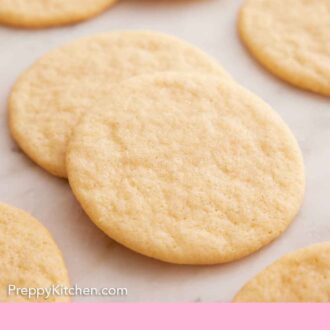Pinterest graphic of a tea cake stacked over another with more tea cakes in the background.