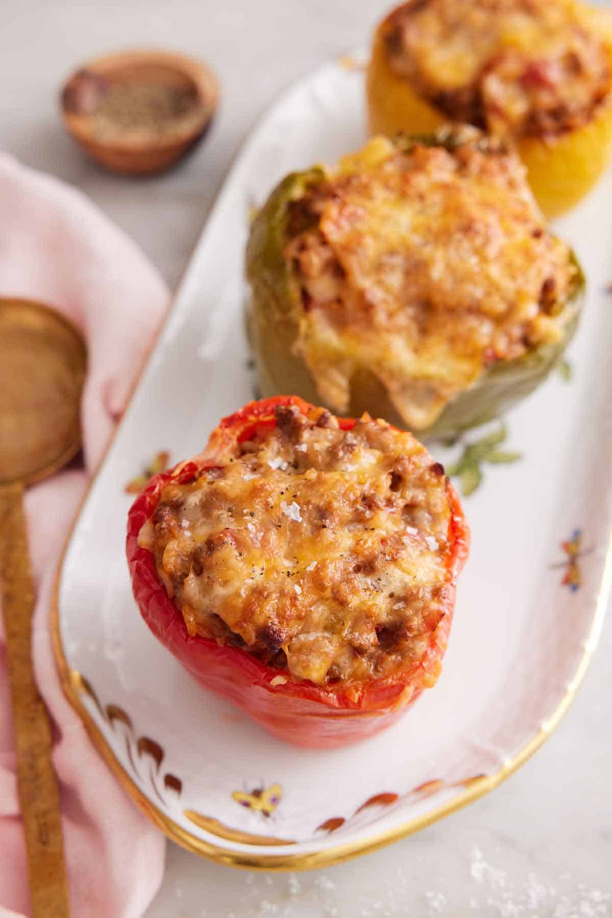 A platter of three air fryer stuffed peppers.