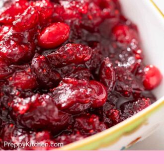 Pinterest graphic of close up view of easy cranberry sauce in a bowl.