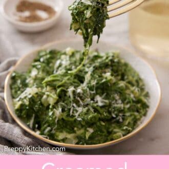 Pinterest graphic of a forkful of creamed spinach lifted from a bowl.
