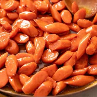 A skillet of glazed carrots.
