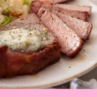 Pinterest graphic of a close up view of air fryer steak sliced, showing the interior of the slices.