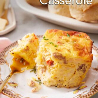 Pinterest graphic of a plate with a piece of breakfast casserole with a bite on a fork.