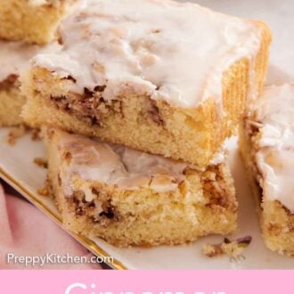 Pinterest graphic of a stack of two slices cinnamon roll cake on a platter.