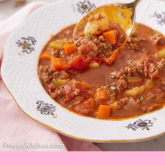 Pinterest graphic of a spoon lifting hamburger soup from the bowl.