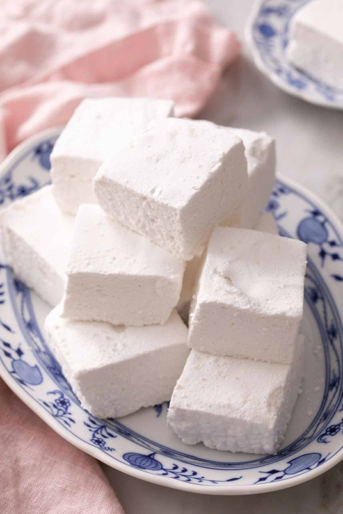 A platter of homemade marshmallow recipe cut into squares.