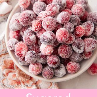Pinterest graphic of an overhead view of a bowl of sugared cranberries.