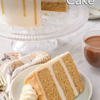 Pinterest graphic of a slice of butterscotch cake on a plate with the rest of the cake in the background on a cake stand.