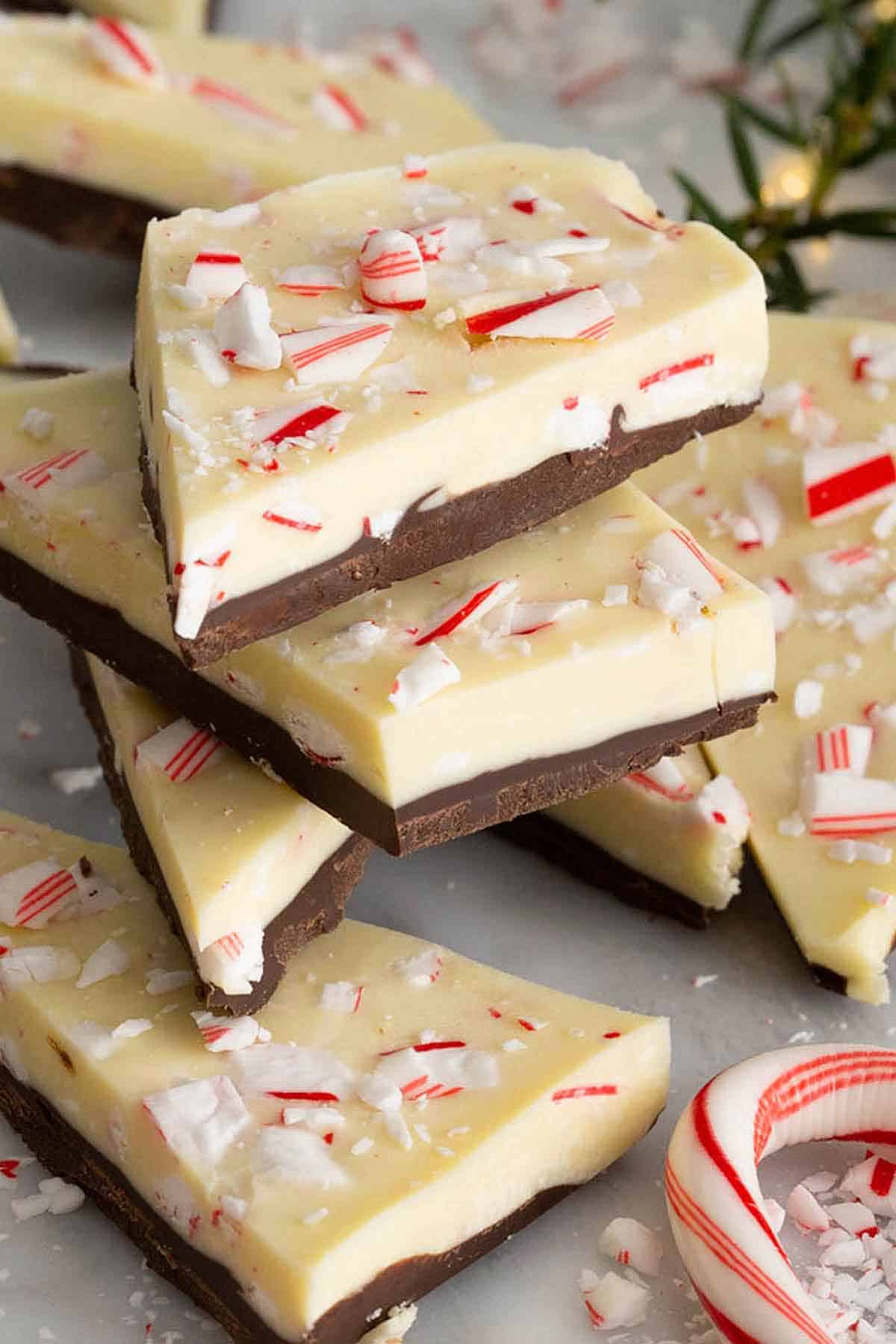 Multiple pieces of peppermint bark stacked on top of each other.