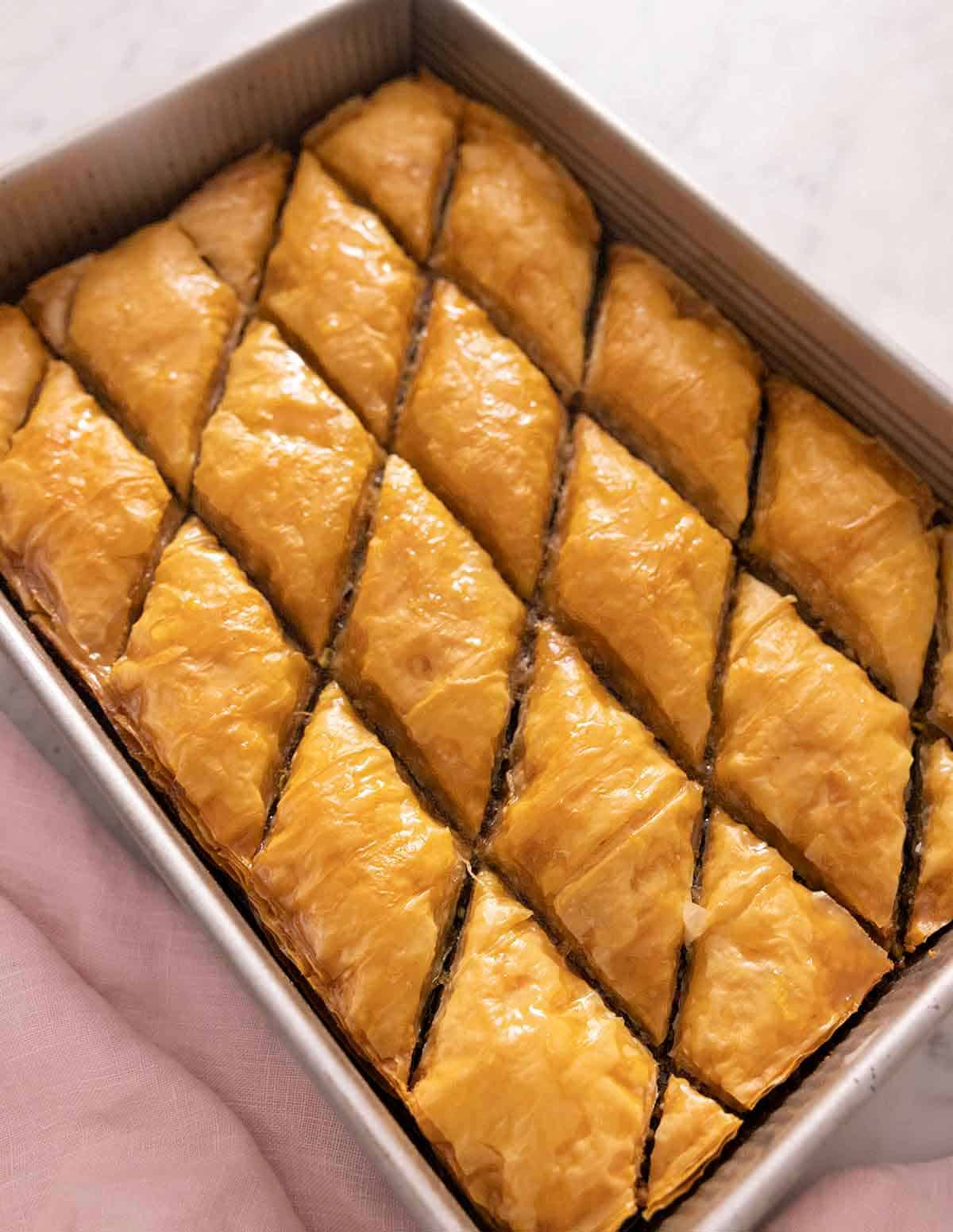 A baking dish with cut baklava.