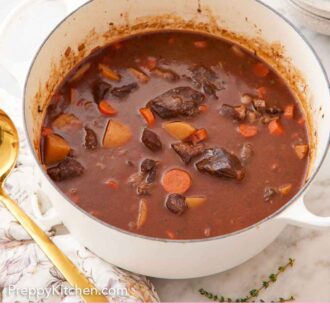 Pinterest graphic of a white dutch oven with beef stew inside. Some bowls, bread, and a ladle around the pot.