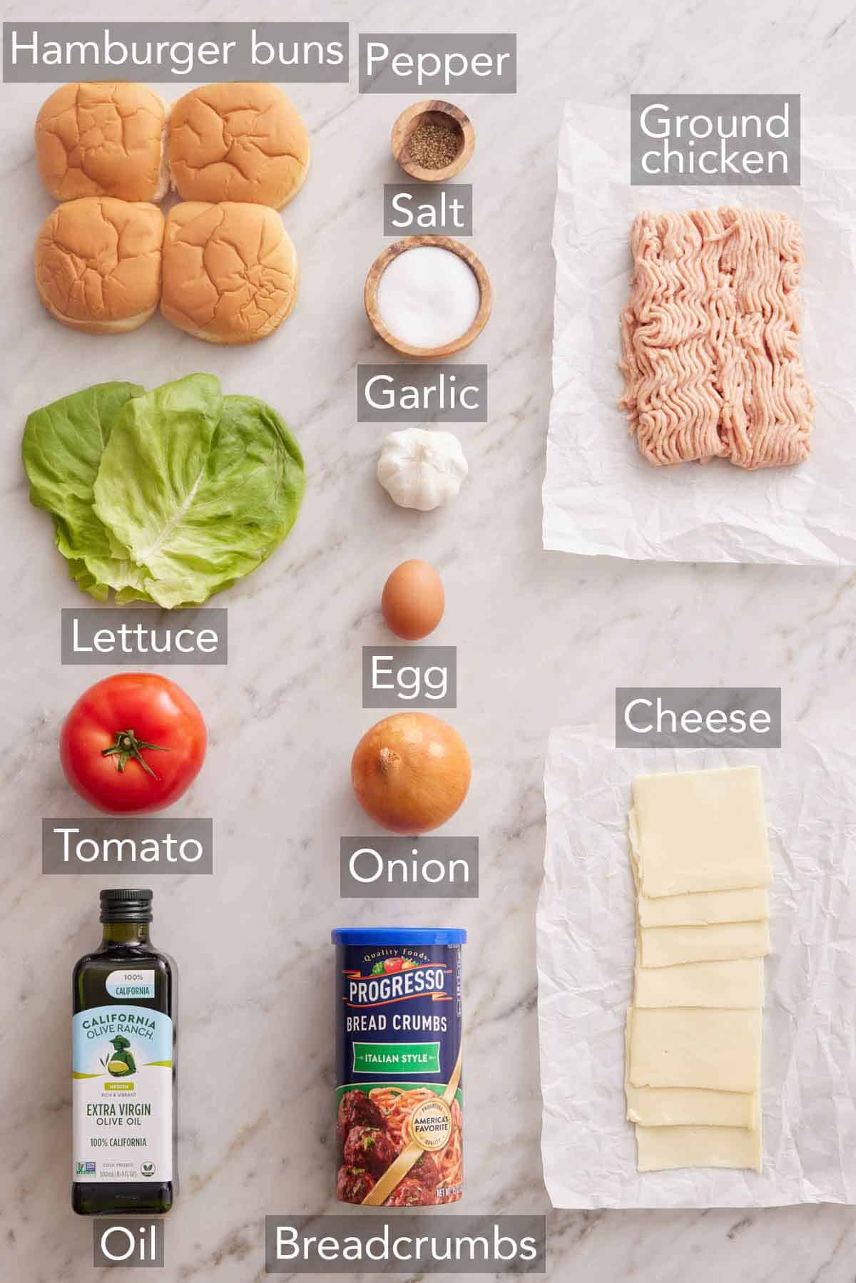 Ingredients needed to make a chicken burger.