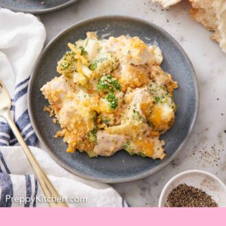 Pinterest graphic of an overhead view of a plate of chicken divan with some torn bread on the side.