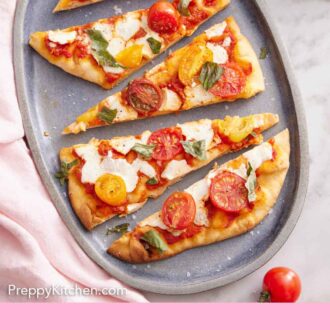 Pinterest graphic of an overhead view of a platter of flatbread pizza sliced into triangle pieces.