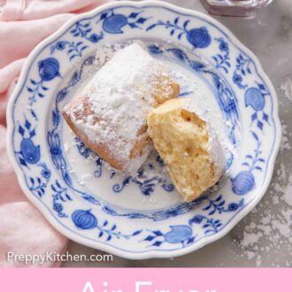 Pinterest graphic of a plate with a whole air fryer beignets and one half, showing the interior.