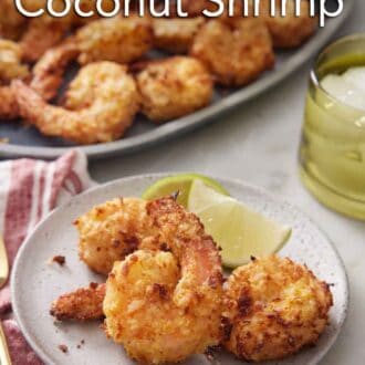 Pinterest graphic of a plate of air fryer coconut shrimp with lime. A platter with more shrimp in the background.