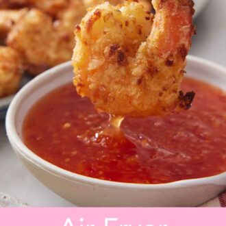 Pinterest graphic of an air fryer coconut shrimp dipped into a bowl of sweet chili sauce.