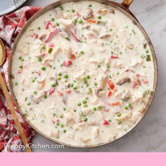Pinterest graphic of an overhead view of a skillet of chicken a la king.
