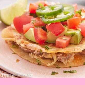 Pinterest graphic of a plate with mulitas topped with diced tomatoes, avocados, and jalapenos.