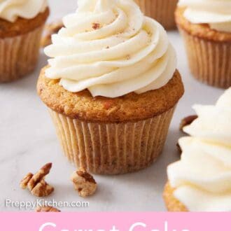 Pinterest graphic of a carrot cake cupcake with some walnuts scattered around along with more cupcakes in the background.