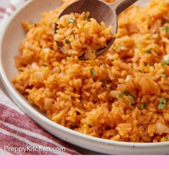 Pinterest graphic of a spoon of Mexican rice lifted from a plate.