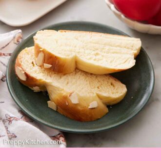 Pinterest graphic of two slices of tsoureki on a green plate with pink eggs in the background.