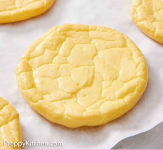 Pinterest graphic of multiple cloud bread on a sheet of parchment.