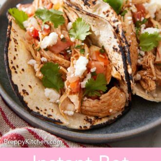 Pinterest graphic of two Instant Pot chicken tacos on a plate.