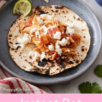 Pinterest graphic of a plate with an opened Instant Pot chicken tacos with crumbled cheese on top.