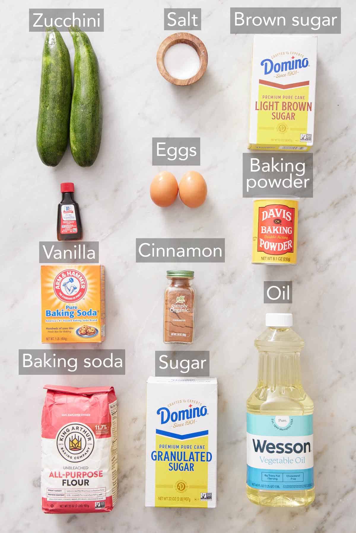 Ingredients needed to make zucchini muffins.