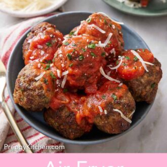 Pinterest graphic of a bowl of air fryer meatballs with sauce on top.