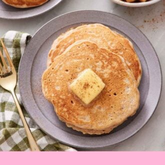 Pinterest graphic of an overhead view of a plate with apple pancakes topped with butter and cinnamon.