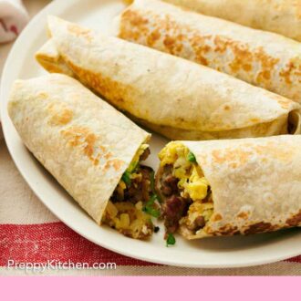 Pinterest graphic of a platter with four breakfast burritos with the one in front cut in half.