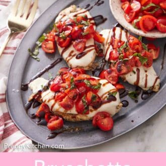Pinterest graphic of a platter with three bruschetta chicken with a bowl of tomatoes.