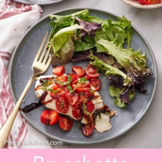 Pinterest graphic of an overhead view of a plate of bruschetta chicken and mixed greens with a fork.