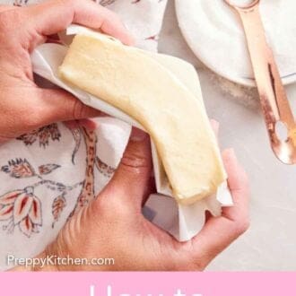 Pinterest graphic of a hand bending a stick of softened butter. A plate of sugar with a measuring spoon on the counter.