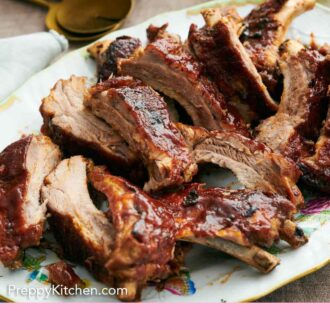 Pinterest graphic of a platter of Instant Pot ribs. Vegetables and barbecue sauce in the background.