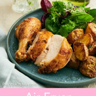 Pinterest graphic of cut pieces of air fryer whole chicken on a plate with potatoes and salad.