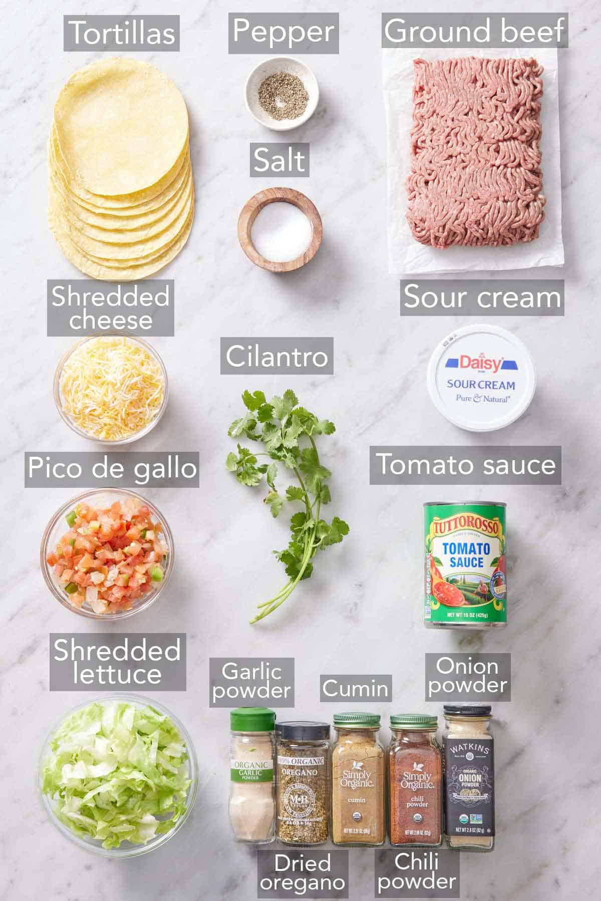 Ingredients needed to make ground beef tacos.