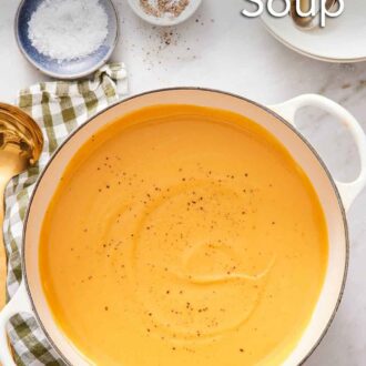 Pinterest graphic of a white dutch oven of sweet potato soup topped with black pepper.