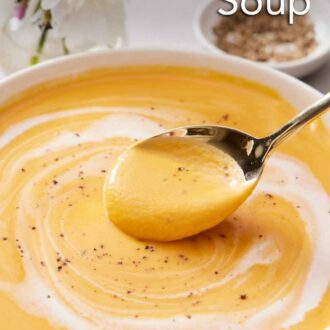 Pinterest graphic of a bowl of sweet potato soup with a spoonful lifted up.