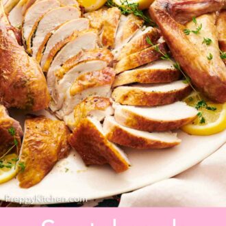 Pinterest graphic of a sliced spatchcock turkey with cut lemons and fresh herbs.