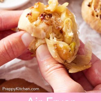 Pinterest graphic of cloves squeezed out of the air fryer roasted garlic head.