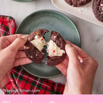 Pinterest graphic of an overhead view of a chocolate peppermint bark cookie being pulled in half over a green plate.