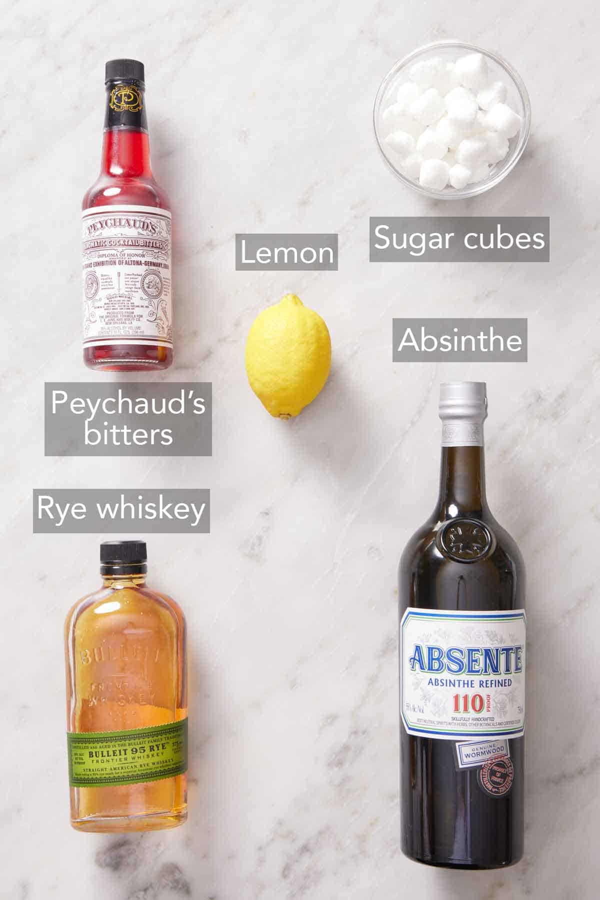 Ingredients needed to make a Sazerac cocktail.