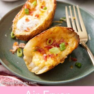 Pinterest graphic of a plate with two air fryer potato skins with green onions on top with a fork on the side.