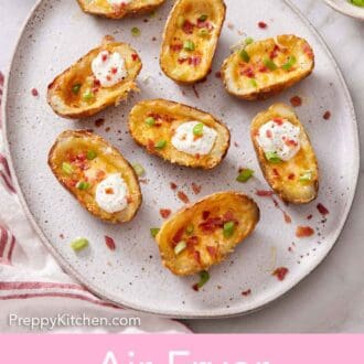 Pinterest graphic of a platter of air fryer potato skins with green onion garnished on top.