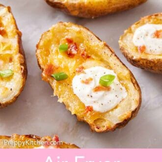 Pinterest graphic of a close up view of air fryer potato skins with green onions, crumbled bacon, and sour cream.