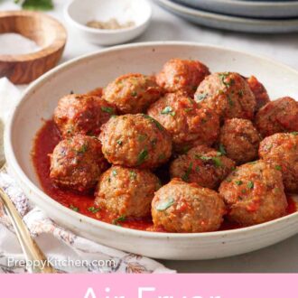 Pinterest graphic of a bowl of air fryer turkey meatballs coated in tomato sauce.